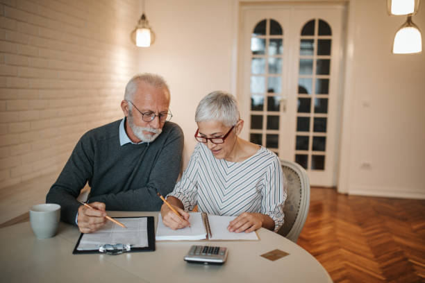  A senior couple taking a closer look at their budget in the comfort of their home.